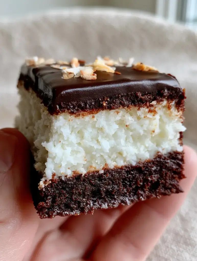 Gourmet Mounds brownies on a neutral background showing clean sharp edges.